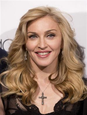 Madonna a dezvăluit că a fost în patul lui Donald Trump atunci când a pozat pentru o revistă