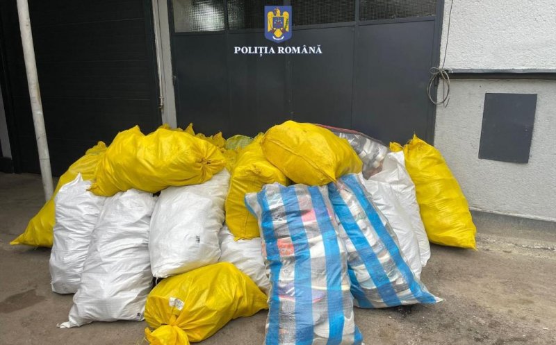 Un hoț a fost reținut de polițiștii clujeni după ce a furat saci cu haine de 20.000 de euro